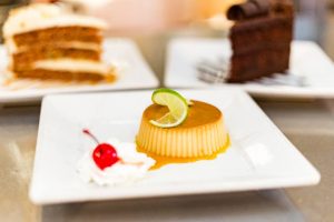 Flan Dessert with Whip cream and a cherry